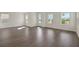 Spacious living room with hardwood floors, several windows providing great sunlight at 130 Bragg Ln, Lakewood Ranch, FL 34240
