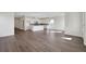 Open-concept living space with hardwood floors and abundant natural light at 130 Bragg Ln, Lakewood Ranch, FL 34240