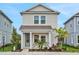 Charming two-story home with a well-maintained lawn, complemented by decorative landscaping, and inviting curb appeal at 134 Bragg Ln, Lakewood Ranch, FL 34240