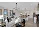 Open-concept living space that flows into a modern kitchen and dining area, great for entertaining at 134 Bragg Ln, Lakewood Ranch, FL 34240