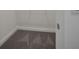 Neutral tone carpet in the closet, as seen next to the white wall and baseboard at 138 Bragg Ln, Lakewood Ranch, FL 34240