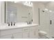 Clean bathroom featuring a double sink vanity and a glass-enclosed shower at 145 Thorne Ln, Lakewood Ranch, FL 34240
