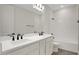 Bright bathroom featuring a double sink vanity and modern fixtures at 145 Thorne Ln, Lakewood Ranch, FL 34240