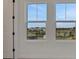 Large windows offer neighborhood views and natural light, enhancing this room's appeal at 145 Thorne Ln, Lakewood Ranch, FL 34240