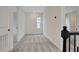 Second floor hallway with plush neutral carpeting, white walls, and modern fixtures at 145 Thorne Ln, Lakewood Ranch, FL 34240