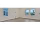 This living room has three large windows and wood floors at 145 Thorne Ln, Lakewood Ranch, FL 34240