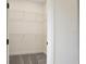 Simple walk-in closet with wire shelving and neutral carpeting at 145 Thorne Ln, Lakewood Ranch, FL 34240