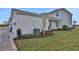 Charming home featuring a landscaped yard with healthy green grass and a pristine white exterior finish at 149 Thorne Ln, Lakewood Ranch, FL 34240