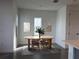 Bright dining room with modern decor, light gray floors, and minimalist wall art at 172 Eagleston Ln, Lakewood Ranch, FL 34240