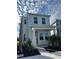 Charming two-story home featuring a covered porch, manicured landscaping, and a freshly paved walkway at 172 Eagleston Ln, Lakewood Ranch, FL 34240