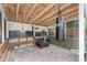 Covered patio with brick flooring, heavy bag, and weight bench at 1701 38Th Ave, St Petersburg, FL 33713