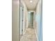 Hallway with tile flooring and neutral walls at 9607 Lemon Drop Loop, Ruskin, FL 33573