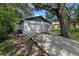 White brick garage with a long driveway at 7018 N Center Dr, Tampa, FL 33604