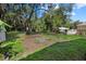 Large backyard with mature trees and open space at 7018 N Center Dr, Tampa, FL 33604