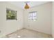 Simple bedroom with two windows and light-colored walls at 19 Ventura Dr, Dunedin, FL 34698