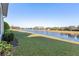 Peaceful backyard view overlooking a serene lake at 2429 Nottingham Greens Dr # 118, Sun City Center, FL 33573