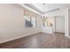 Formal dining room with hardwood floors and elegant chandelier at 2429 Nottingham Greens Dr # 118, Sun City Center, FL 33573