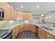 Large kitchen with granite counters and stainless steel appliances at 2429 Nottingham Greens Dr # 118, Sun City Center, FL 33573