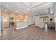 Open concept kitchen and living area with hardwood floors at 2429 Nottingham Greens Dr # 118, Sun City Center, FL 33573