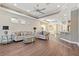 Living room with hardwood floors and access to backyard at 2429 Nottingham Greens Dr # 118, Sun City Center, FL 33573