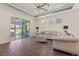 Bright living room with hardwood floors and backyard access at 2429 Nottingham Greens Dr # 118, Sun City Center, FL 33573