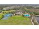 Community clubhouse, pool, tennis courts, and green space at 4808 111Th E Ter, Parrish, FL 34219