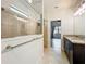 Bathroom featuring granite countertops, double sinks, and a tiled walk-in shower at 4808 111Th E Ter, Parrish, FL 34219