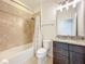 Bathroom featuring granite countertops, tub with shower, and modern fixtures at 4808 111Th E Ter, Parrish, FL 34219
