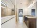 Bathroom featuring granite countertops, double sinks, and a tiled walk-in shower at 4808 111Th E Ter, Parrish, FL 34219