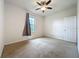 Neutral bedroom with carpeted floor, a ceiling fan, a single window, and a closet at 4808 111Th E Ter, Parrish, FL 34219