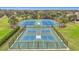 Community tennis and basketball courts with palm tree landscaping at 4808 111Th E Ter, Parrish, FL 34219