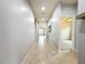 Hallway with tile flooring leading to other rooms, and recessed lighting for illumination at 4808 111Th E Ter, Parrish, FL 34219