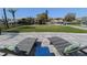 Spacious backyard featuring waterfront views and lounge chairs at 817 Blue Heron Blvd, Ruskin, FL 33570