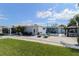Outdoor living at its finest with a pool, patio furniture, and a spacious backyard, perfect for entertaining at 817 Blue Heron Blvd, Ruskin, FL 33570
