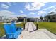 Inviting backyard featuring a lawn, fire pit and gazebo for entertaining and water access for enjoying the outdoors at 817 Blue Heron Blvd, Ruskin, FL 33570