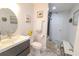 Updated bathroom features a shower and modern vanity with updated fixtures at 817 Blue Heron Blvd, Ruskin, FL 33570