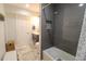 Bathroom featuring modern vanity, tiled shower with niche, and tiled flooring at 817 Blue Heron Blvd, Ruskin, FL 33570