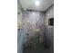 Bathroom showcasing an oversized shower with custom tile and brass accents at 817 Blue Heron Blvd, Ruskin, FL 33570