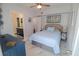 Comfortable bedroom with ensuite bathroom access and ample space at 817 Blue Heron Blvd, Ruskin, FL 33570
