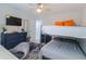 Bedroom featuring bunk beds, ceiling fan, and a coordinating dresser at 817 Blue Heron Blvd, Ruskin, FL 33570