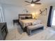 Comfortable bedroom featuring a ceiling fan, and an exterior door to the outside at 817 Blue Heron Blvd, Ruskin, FL 33570