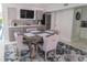 Dining room featuring a wet bar, wine fridge, and seating for six at 817 Blue Heron Blvd, Ruskin, FL 33570