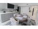 Dining room featuring a wet bar, wine fridge, and seating for six at 817 Blue Heron Blvd, Ruskin, FL 33570