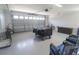 Spacious garage with epoxy flooring, room for multiple cars and storage, perfect for organization at 817 Blue Heron Blvd, Ruskin, FL 33570