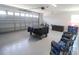 Clean and organized garage with epoxy flooring, providing ample storage and parking space at 817 Blue Heron Blvd, Ruskin, FL 33570