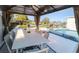 Outdoor gazebo offering a dining table with seating, a cozy space for entertainment by the pool at 817 Blue Heron Blvd, Ruskin, FL 33570