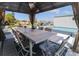 Outdoor gazebo offering a dining table with seating, a cozy space for entertainment by the pool at 817 Blue Heron Blvd, Ruskin, FL 33570