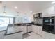Modern kitchen featuring white cabinets, stainless steel appliances, and sleek countertops at 817 Blue Heron Blvd, Ruskin, FL 33570