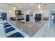 Spacious kitchen island featuring stone countertops and pendant lighting at 817 Blue Heron Blvd, Ruskin, FL 33570