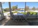 Enclosed lanai with seating featuring a lovely view of the yard and canal at 817 Blue Heron Blvd, Ruskin, FL 33570
